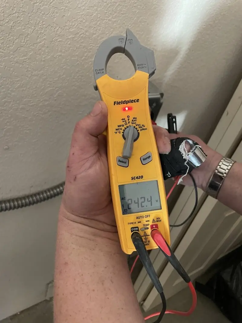 Voltage testing with clamp meter during Aluminum Wiring Replacement in Casas Adobes